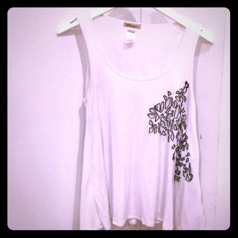 White, flowy, loose fitting tank top type shirt.